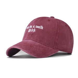 Vintage washed burgundy baseball cap with white embroidered out for a walk text