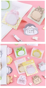 Close-up of cute standing animal sticky notes including pig, bear and cat designs