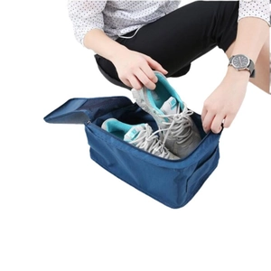 Waterproof nylon travel shoe storage bag in deep blue with top zipper and carry handle