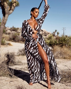 Detail of zebra print beach cover-up and matching bikini set in warm brown tones