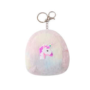 Detail of plush unicorn keychain with rainbow gradient fur and silver metal clasp