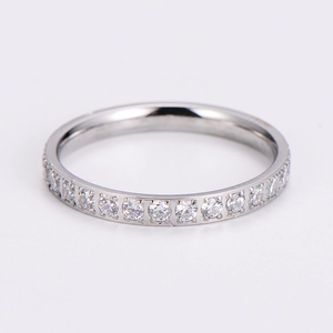 Close-up of sparkling silver stainless steel eternity ring with paved clear crystals