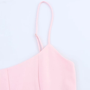 Detail of adjustable spaghetti straps on a pink striped mini dress with high quality seams