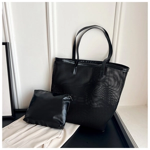 Detail of black mesh tote bag with a matching faux leather inner zipper pouch