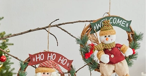 Detail of Santa and Snowman rattan wreaths with Welcome and Ho Ho Ho signs