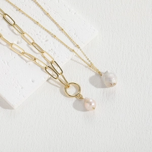 Minimalist gold paperclip and fine chain necklaces with elegant freshwater pearl pendants