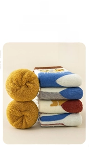 Close-up of thick terry socks with colorful patterns and warm winter fabric texture