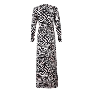Detail view of the zebra print maxi dress featuring black and white patterns with pink accents