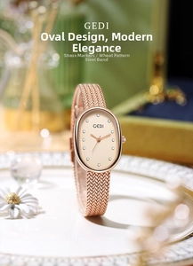 Close-up of elegant oval watch with mother-of-pearl dial and rose gold wheat strap