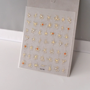 Golden 5D bowknot and floral nail stickers with sparkling rhinestones on transparent sheet