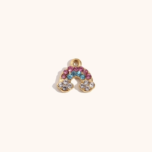 Close-up of 14K gold rainbow pendant with inlaid purple, blue, and white crystals