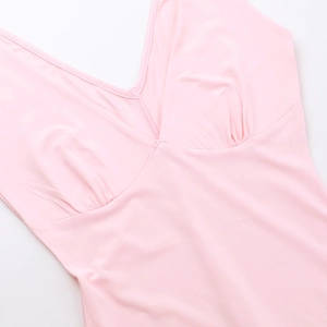 Close-up of pink V-neck ruffle detail on a silky satin dress with fine stitching