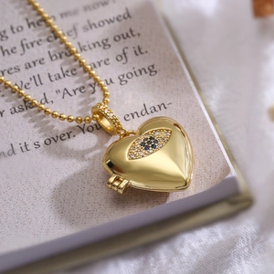 Gold heart locket necklace with evil eye zircon pendant and delicate beaded chain