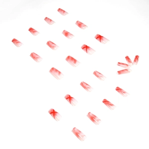 Red and white gradient press-on nails with marble texture and cross patterns