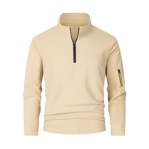 Detail view of the sleeve pocket with neon green trim on a men's fleece pullover