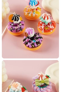 Detailed view of colorful miniature resin donuts and cupcakes with intricate cream patterns