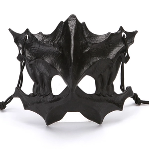 Detail of a black gothic bat mask with 3D embossed textures and elastic strap for cosplay