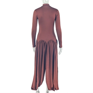 Back view of elegant long-sleeve high-neck dark brown jumpsuit with pleated waist details