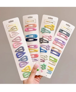 Close-up of macaron color star and heart shape hair clips in variety gift set packaging