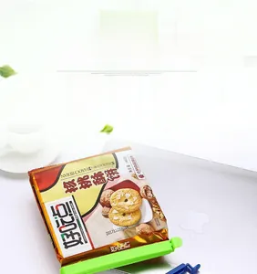 Detail of blue and green plastic sealing clips locking snack bags for food freshness