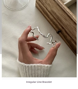 Detailed view of the S925 sterling silver wavy cuff bracelet with minimalist irregular lines