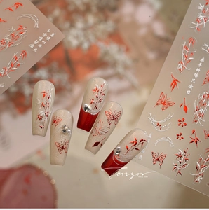 Detail of bamboo and flower nail stickers with 3D rhinestones on long acrylic nails