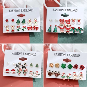 Christmas stud earring set featuring reindeer, snowman, and gingerbread man holiday motifs