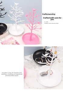 Bird tree jewelry organizer detail showing black, white, and pink branches with base
