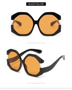 Macro detail of oversized geometric black frames with transparent yellow lenses sunglasses