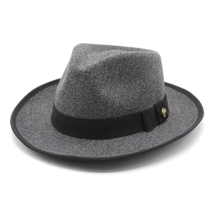 Classic dark grey wool fedora with black ribbon and golden skull accent on white background