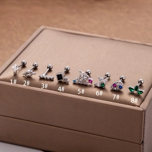 Eight styles of stainless steel stud earrings with colorful zircon inlays on leather display