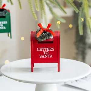 Red metal Letters to Santa mailbox decoration with evergreen wreath and ribbon