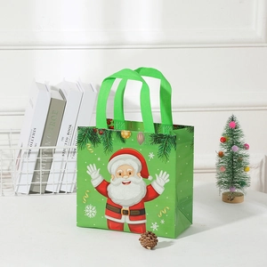 Green Christmas non-woven tote bag featuring cartoon Santa Claus with festive decorations