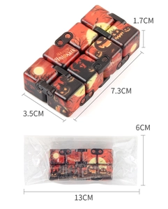 Macro detail of Infinity Cube toy with Halloween pumpkin prints and matte finish