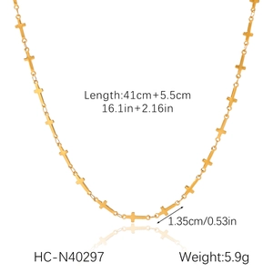 Detailed view of a gold stainless steel necklace with small cross charms and dimensions