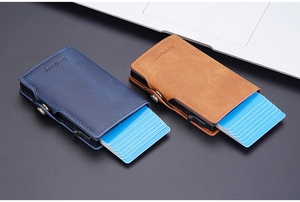 Detail of RFID-blocking pop-up card holder with side slide and buckle closure in business style