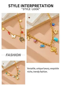 Close-up of gold sweater chains with colorful elephant and heart pendants