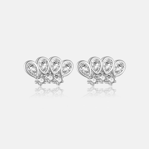 Macro detail of crown shaped S925 silver earrings with clear teardrop zircon stones