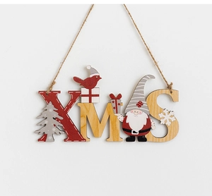 Detail of XMAS wooden hanging sign with red and natural wood letters and festive motifs