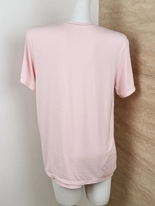 Close-up of pink soft cotton fabric texture and back view on mannequin for loungewear set