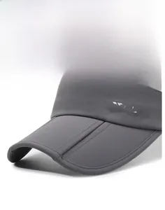 Detail of dark grey sun visor featuring a wide brim and white NY&JA logo embroidery