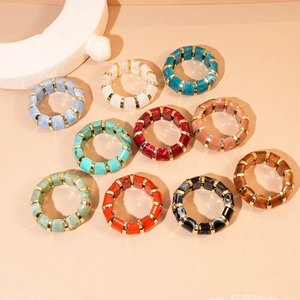 Colorful geometric acrylic bracelets with gold metal spacers in various marble patterns