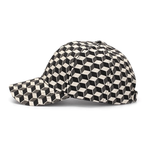 Detailed close-up of 3D cube pattern on canvas baseball cap showing fabric texture