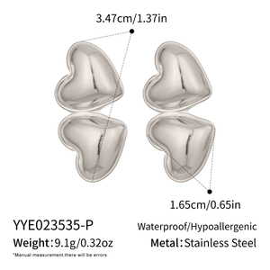 Macro detail of silver stainless steel heart earrings with dimensions and weight specs