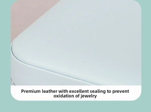 Detailed view of light blue PU leather jewelry box showing moisture-proof sealed texture