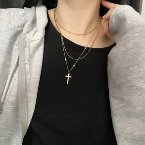 Three-layer gold titanium steel necklace with cross pendant for a minimalist layered look