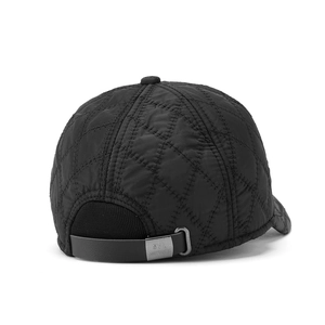 Detail of winter baseball cap showing quilted diamond pattern and adjustable leather strap