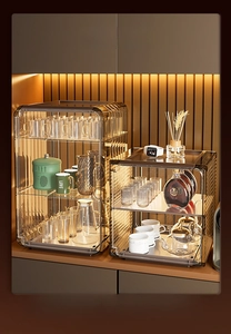 Close-up of luxury amber transparent acrylic storage cabinets for kitchen cups and bottles
