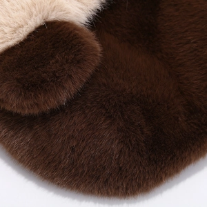 Detail of high-density faux fox fur texture showing soft brown and beige plush material