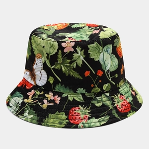 Close-up of strawberry and butterfly floral print on black canvas bucket hat fabric